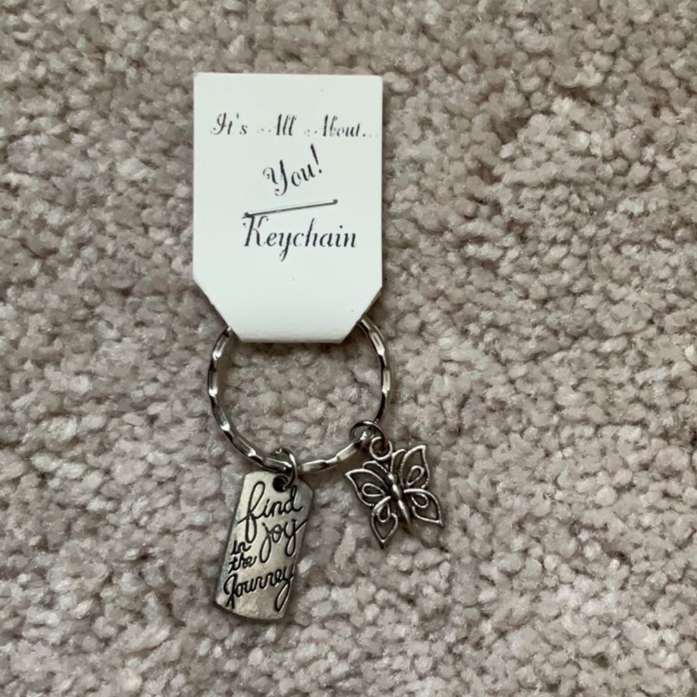 Find Joy in the Journey and butterfly charm on a keychain